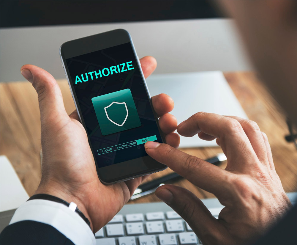 A man using his phone for two factor authentication