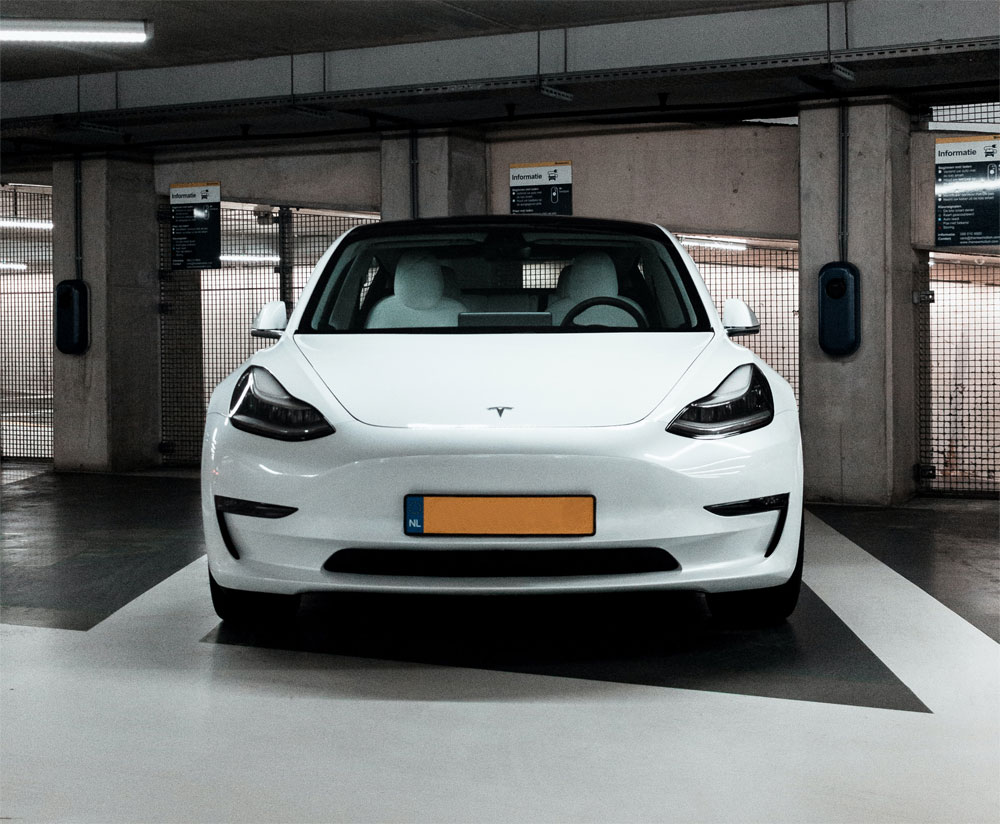 A self-driving vehicle parked in a parking lot