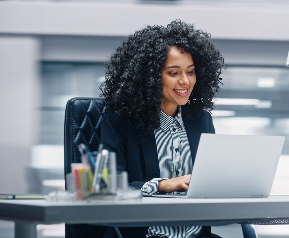 A woman checking her loyalty program on her laptop